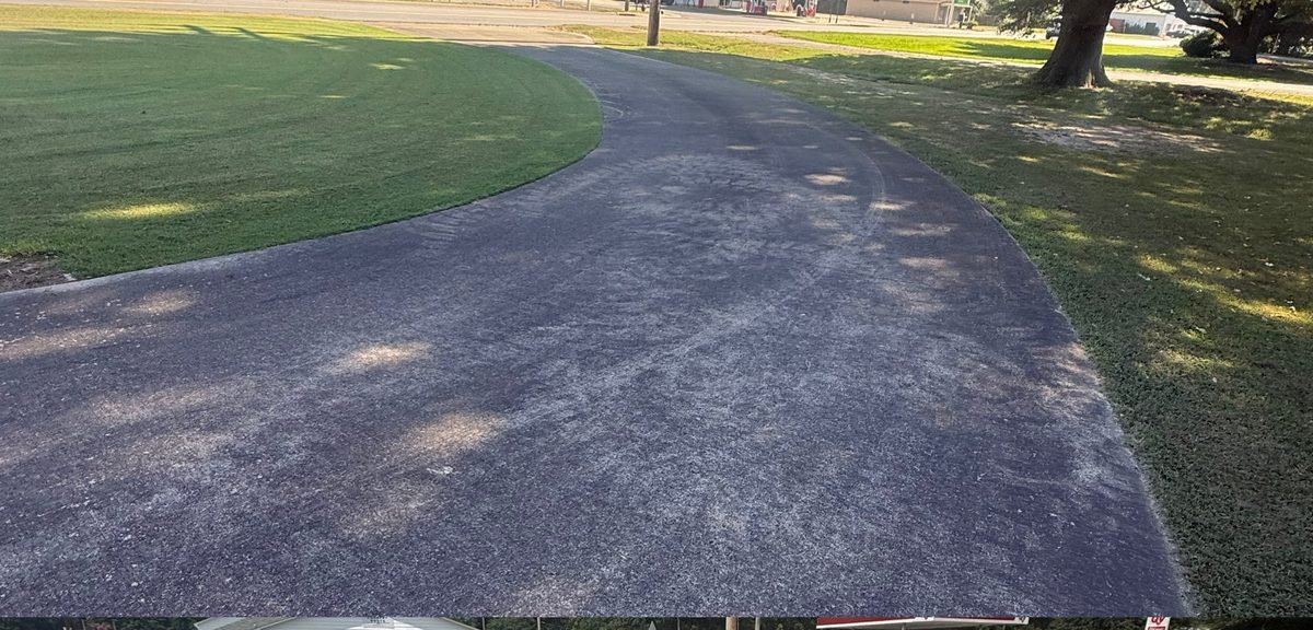 Dirty driveway before pressure washing