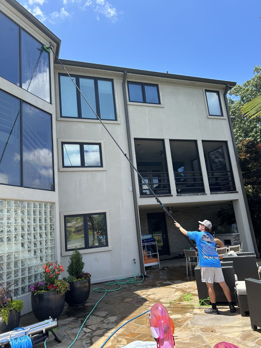 Nick Brown's Exterior Cleaning washing second-story windows